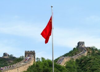 chinese flag and great wall of china in beijing