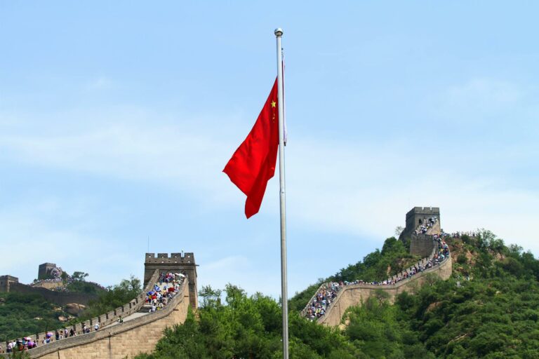 chinese flag and great wall of china in beijing